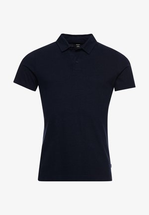 Laivastonsininen lyhythihainen poolopaita, jossa on napillinen kaulus ja pehmeästä puuvillakankaasta.