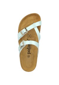 White leather sandal with two adjustable straps, metal buckles, and a contoured brown footbed. Features a logo printed on the insole.