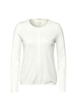 Langærmet hvid top med rund hals, der har en central sømdetalje og samlet kant. Lavet af blødt bomuldsstof.