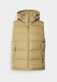Gilet imbottito beige con cappuccio, caratterizzato da una chiusura con zip, tasche laterali e cuciture orizzontali per l'isolamento. Tessuto liscio in tutto.