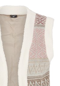 Ärmlös väst i mjukt, krämfärgat shearlingmaterial. Har mönstrad tyg i rosa, beige och grått längs sidorna.