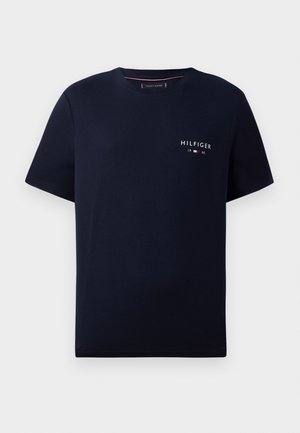 T-shirt in cotone blu navy con maniche corte, collo rotondo e un piccolo logo bianco "HILFIGER 1985" sul petto. Tessuto morbido.