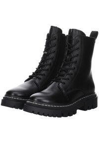 Bottes de combat en cuir noir à lacets, semelles épaisses à crampons, fermeture éclair latérale et languette à l'arrière pour un soutien de la cheville et un enfilage facile.