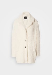 Kreemi faux-fur takki, jossa on lovellinen kaulus, etupainike, kaksi sivutaskua ja pehmeä pinta.