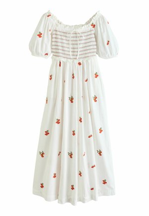 White off-shoulder dress with puff sleeves, smocked bodice, and red cherry print scattered across the fabric.