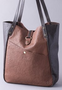 Brown and black leather tote bag with a structured shape, featuring a diagonal seam, rivet accents, and dual shoulder straps.