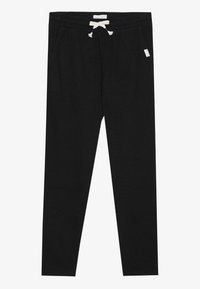 Schwarze gerippte Jogginghosen mit elastischem Bund, Kordelzug und Seitentaschen. Mit einem kleinen Stoffetikett in der Nähe des Bundes.