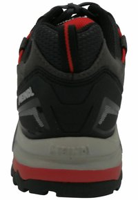 Black hiking shoe with red and gray accents. Mesh texture on upper, padded collar, and contrasting sole. Sturdy rubber outsole for traction.