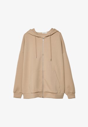 Beige lynlås hoodie med hætte, store frontlommer og ribbede manchetter. Fremstillet af blødt stof, med en afslappet pasform og minimalistisk design.