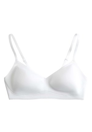 Reggiseno wireless bianco con spalline sottili regolabili e coppe modellate lisce per il comfort quotidiano.