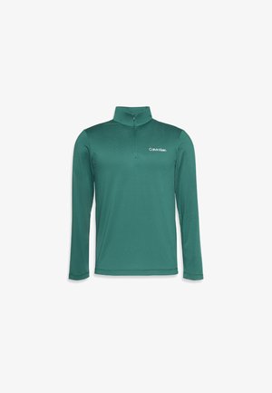 Teal langermet halv-glidelås genser laget av lett materiale, med en mock-krage og preget Calvin Klein-logo på brystet.