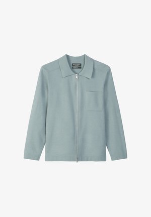 Light blue zip-up jacket made of a soft material, featuring a collar, long sleeves, and a front chest pocket. Simple, clean design.
