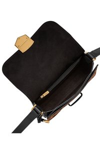 Black leather handbag with gold hardware and a suede interior. Features a zippered pocket and adjustable strap for versatility.