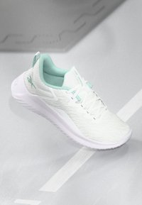 Lightweight athletic shoe in white mesh with mint accents, featuring a textured surface, lace-up design, and cushioned sole.