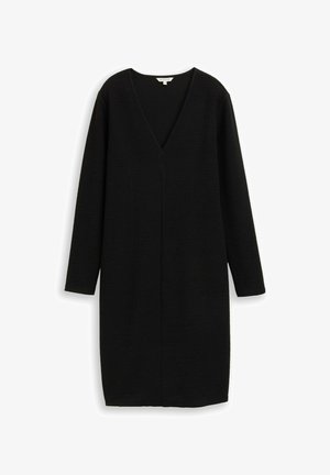 Čierne šaty s výstrihom do V, dlhými rukávmi a textúrovanou tkaninou. Majú rovný strih a dĺžku po kolená. Jednoduchý dizajn, bez vzorov.