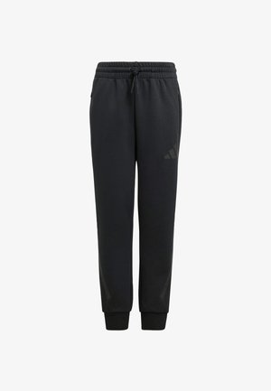 Schwarze Sweatpants mit einem Kordelzugbund, schmal zulaufenden Beinen und einem dezenten, tonalen Dreistreifenmuster nahe dem Unterschenkel. Weicher Stoff.