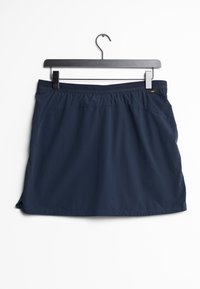 Mörkblå idrottskjol med mjuk textur, elastisk midja och sidofickor; har en rak skärning med en lätt rundad fåll.