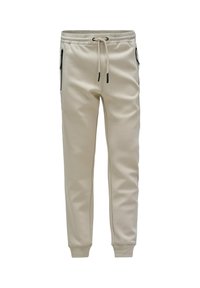 Pantalones de chándal color crema, ajustados, con cintura elástica, cordón, bolsillos laterales con cremallera y puños acanalados en los tobillos.