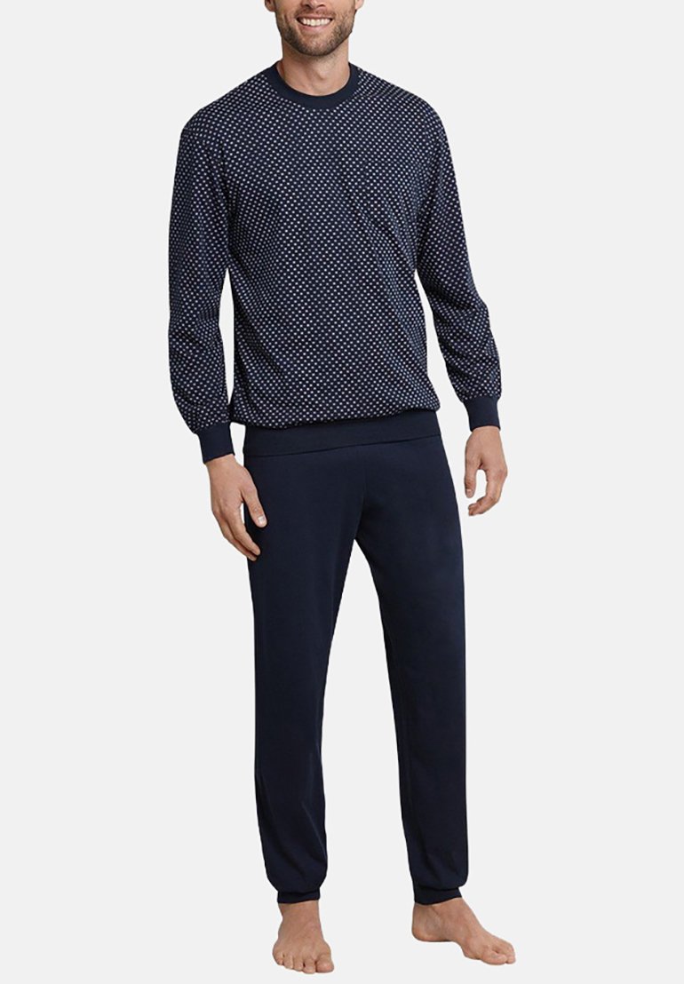 Navy patterned sweatshirt with white dots, ribbed cuffs, and matching navy joggers. Soft fabric; comfortable fit.