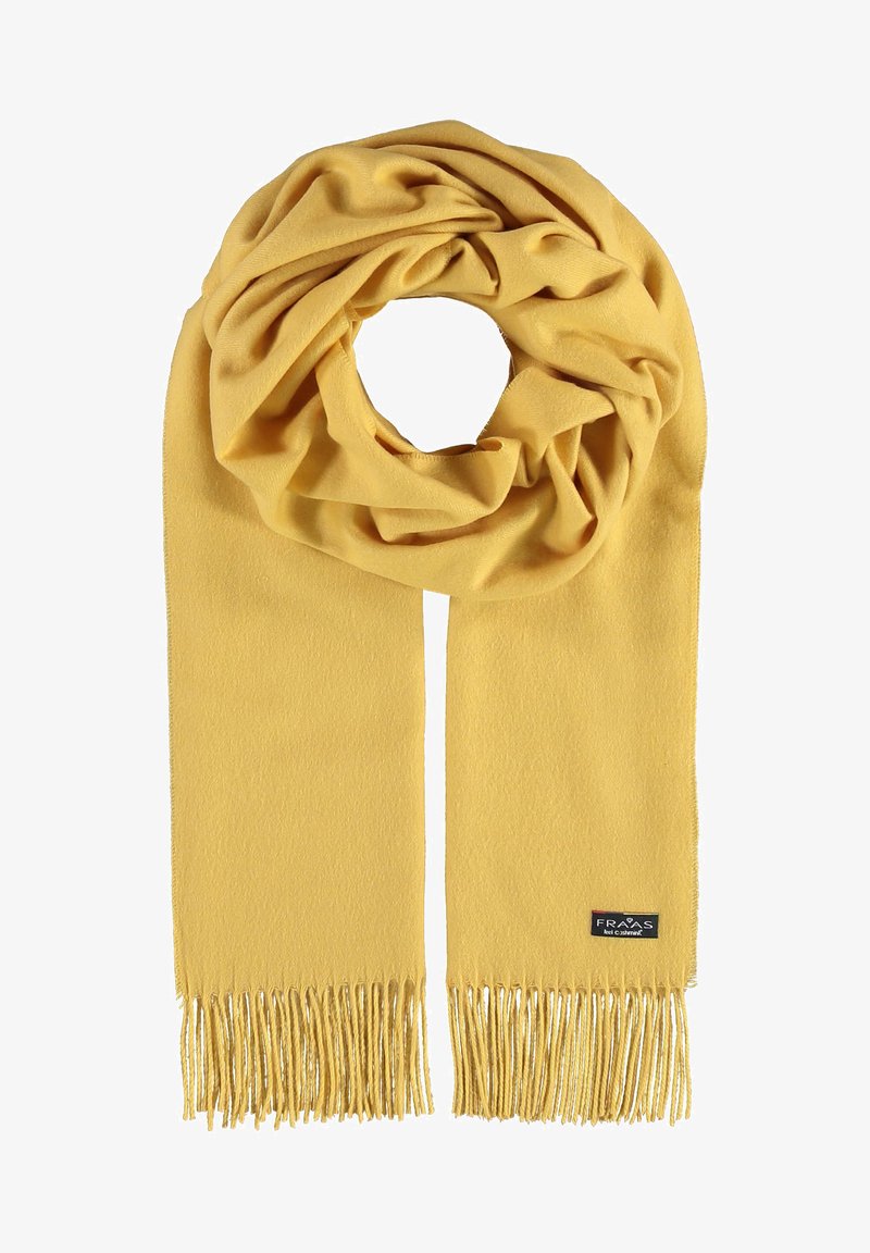 Sciarpa gialla realizzata in morbido tessuto, con una finitura testurizzata e bordi frangiati. Forma circolare quando indossata, con un'etichetta del marchio attaccata.