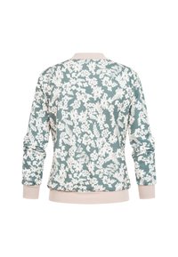 Sweatshirt à manches longues avec poignets et col côtelés rose clair, présentant un motif floral blanc intégral sur un fond vert doux.