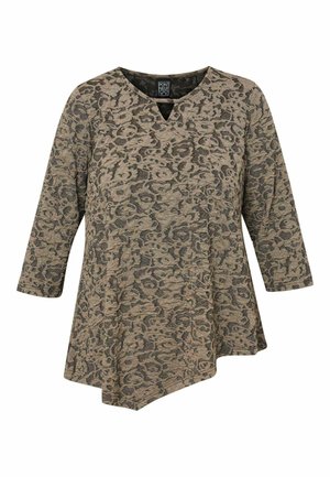 Asümmeetriline tunika beežikas värvuses tume leopardimustriga. Omab V-kaela ja kolmeveerandik-varrukaid, valmistatud tekstureeritud kangast mugavuse tagamiseks.
