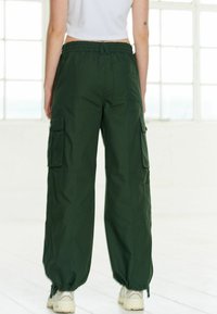 Next RIPSTOP  - Reisitaskuhousut - khaki green