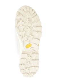 Cream-colored shoe sole featuring deep, multi-directional lugs for traction, textured surface, and a yellow Vibram logo detail.