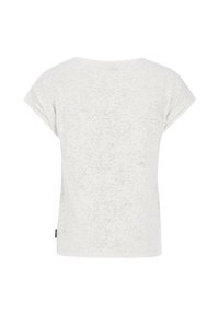 T-shirt s krátkym rukávom, svetlo béžovej farby s textúrovaným vzorom. Okrúhly výstrih a voľný strih. Žiadne viditeľné kovanie ani akcenty.