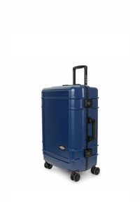 Navy hard-shell suitcase with a textured surface, retractable handle, dual wheels, and combination lock for security.