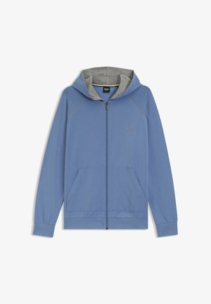 Blauwe zip-up hoodie met een grijze voering in de capuchon, voorzien van twee voorzakken, geribbelde manchetten en contrasterende stiksels. Logo op de borst.