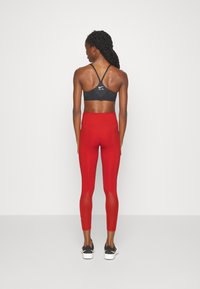 Nike Performance ONE - Leggings - rot/weiss