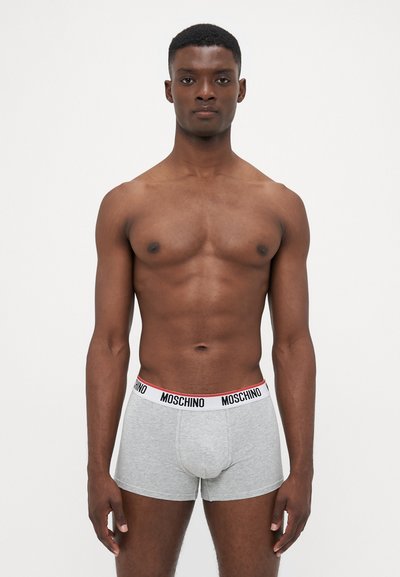 Gray boxer briefs with a white and red Moschino waistband. Fabric is soft and smooth, fitted design with a mid-rise cut, no visible patterns.