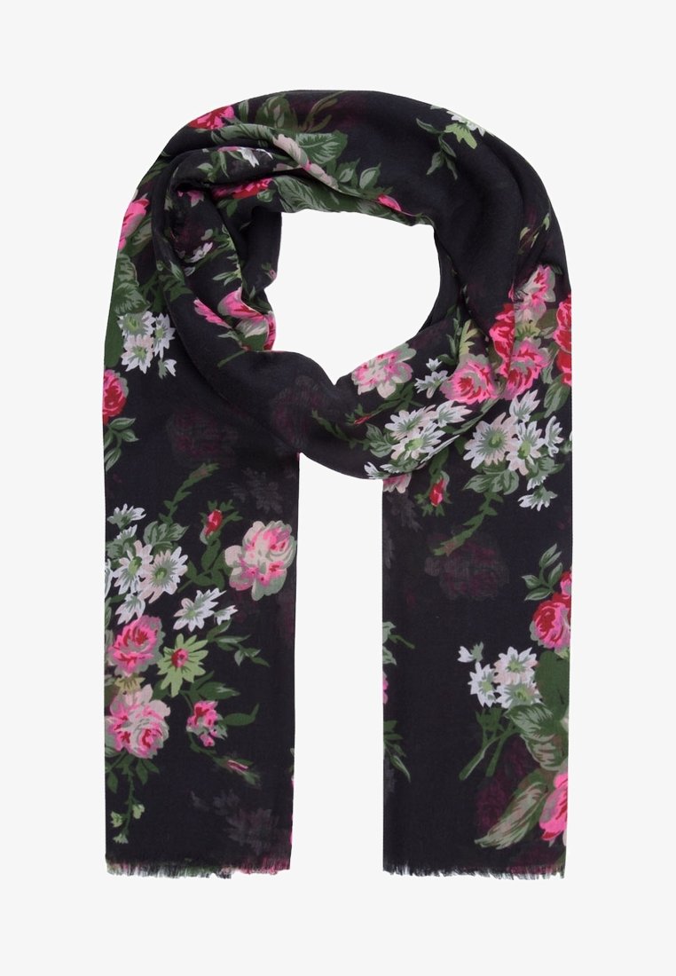 Écharpe noire avec des motifs floraux roses, blancs et verts, bouclée librement avec des bords à franges.