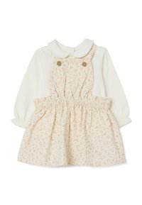 Babyjurk met een witte top en een crèmekleurige rok met bloemenpatroon, voorzien van een kraag en een elastische tailleband. Twee decoratieve knopen aan de voorkant.