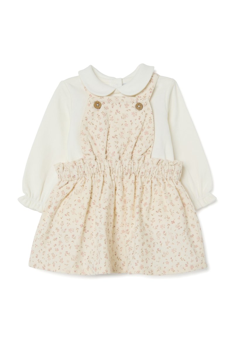 Babyjurk met een witte top en een crèmekleurige rok met bloemenpatroon, voorzien van een kraag en een elastische tailleband. Twee decoratieve knopen aan de voorkant.