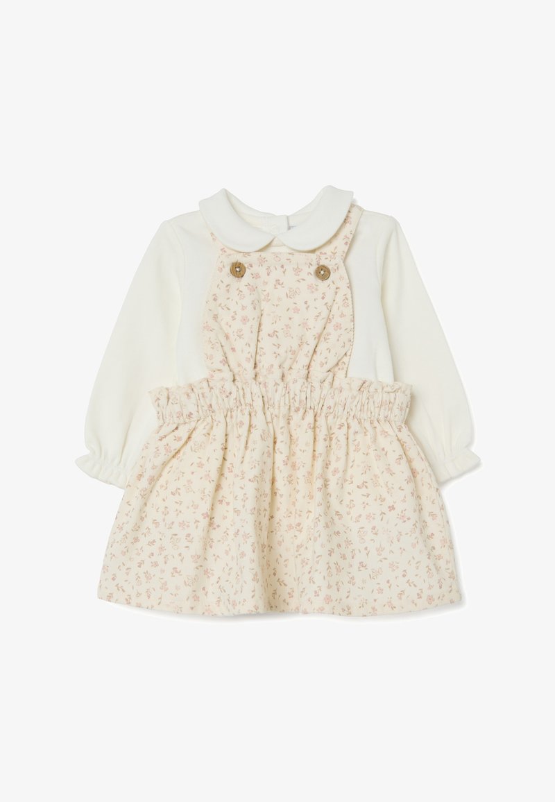 Babyjurk met een witte top en een crèmekleurige rok met bloemenpatroon, voorzien van een kraag en een elastische tailleband. Twee decoratieve knopen aan de voorkant.