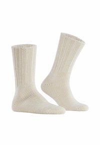 Calze in cotone beige con trama a coste, lunghezza fino al polpaccio e punta rinforzata. Costruzione senza cuciture per il massimo comfort.