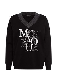 Schwarzer Pullover mit V-Ausschnitt, mit einem Kragen aus silbernem Faden. Das Vorderdesign umfasst weißen und silbernen Text in verschiedenen Schriftarten und Größen.