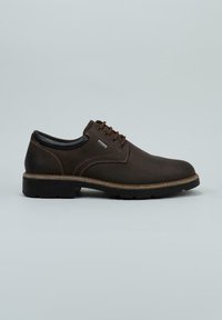 Zapato de cuero marrón oscuro con cordones, suela negra gruesa y acolchado en el collar, diseñado para un uso casual o semi-formal.