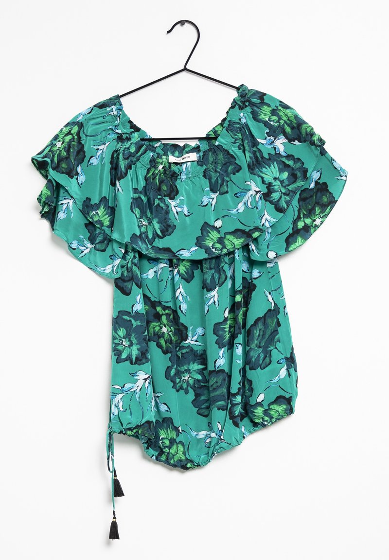 Blusa verde a fantasia floreale con maniche a volant, collo elasticizzato e orlo con coulisse e pon pon. Realizzata in tessuto leggero.