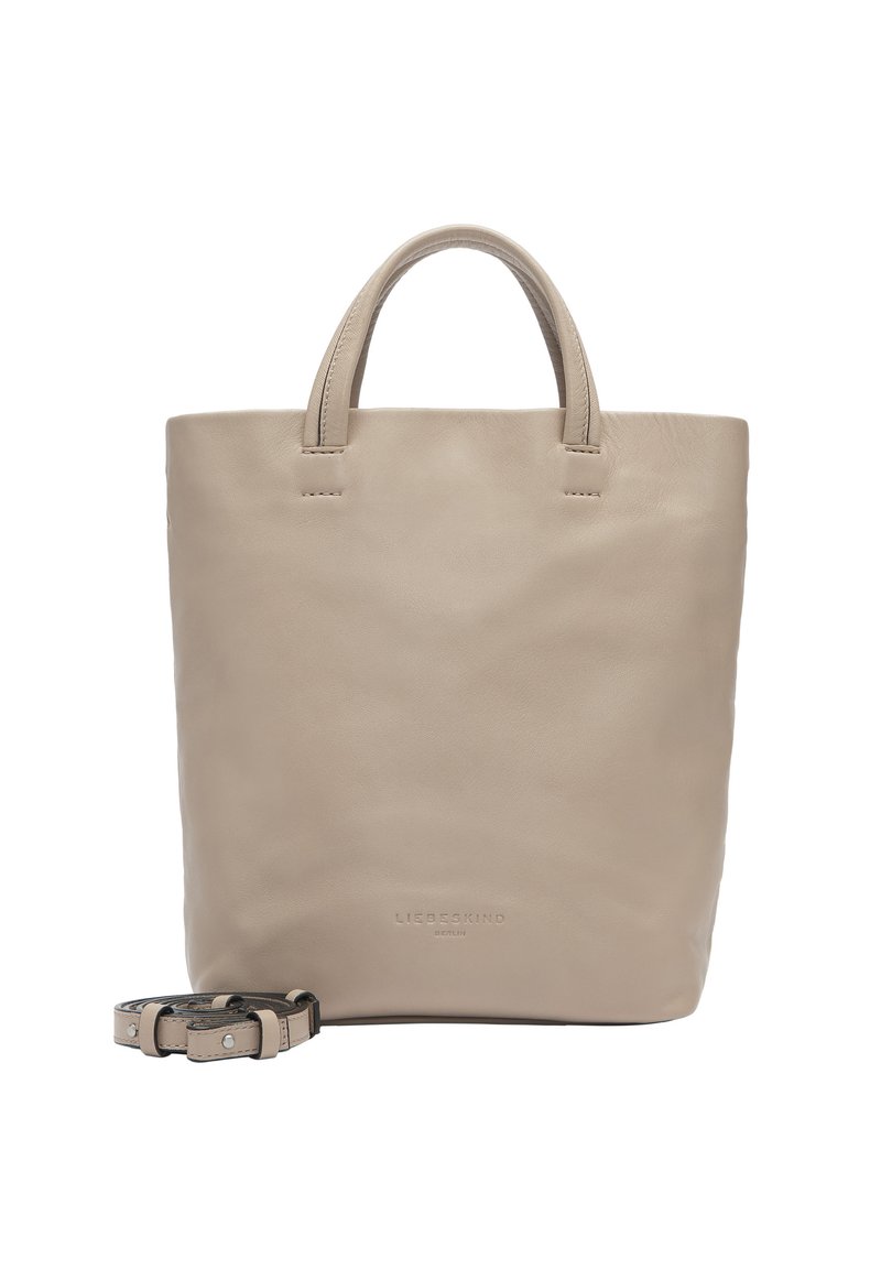 Sac fourre-tout en cuir beige avec deux poignées supérieures et une sangle amovible ; texture lisse sans motifs ni détails matériels visibles.