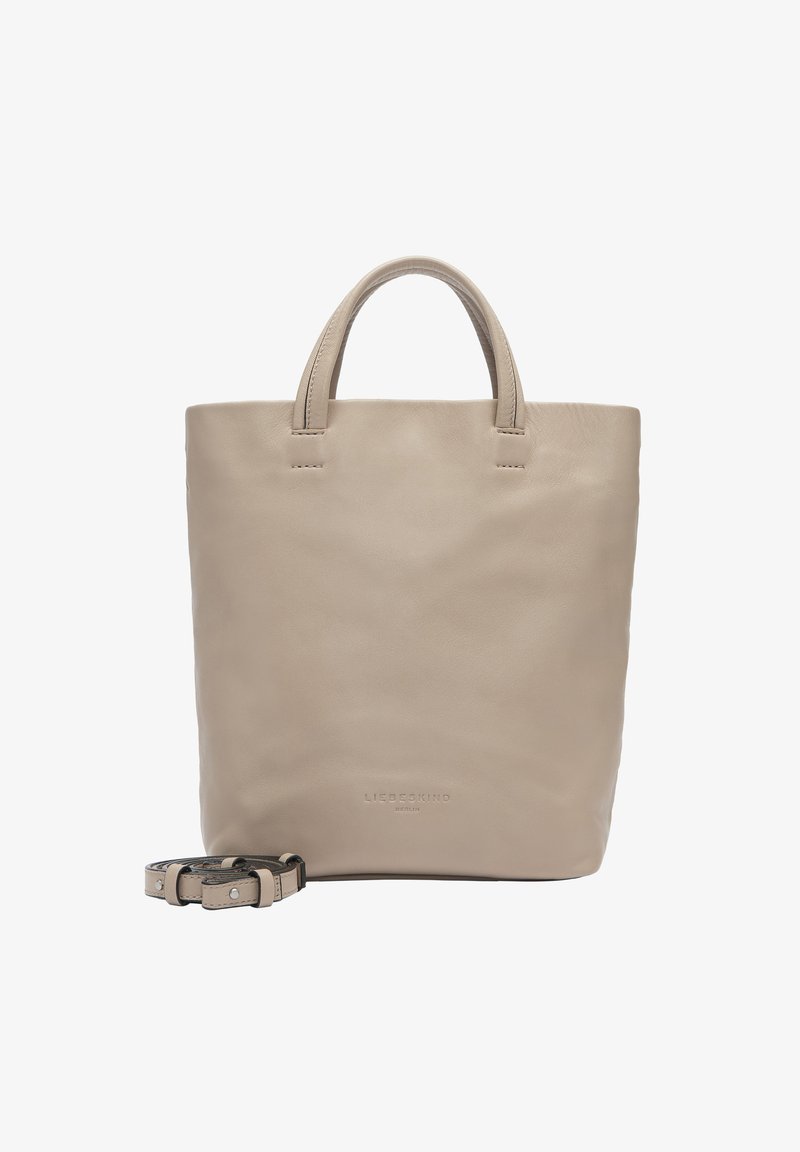 Sac fourre-tout en cuir beige avec deux poignées supérieures et une sangle amovible ; texture lisse sans motifs ni détails matériels visibles.