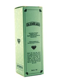Grön papperslåda för skärolja med svart text, diamantlogotyp och ekologisk produktetikett; innehåller jojoba- och arganolja.