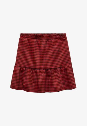 Jupe à carreaux rouge et noir en tissu avec un ourlet à volants. Taille élastique en haut pour le confort.