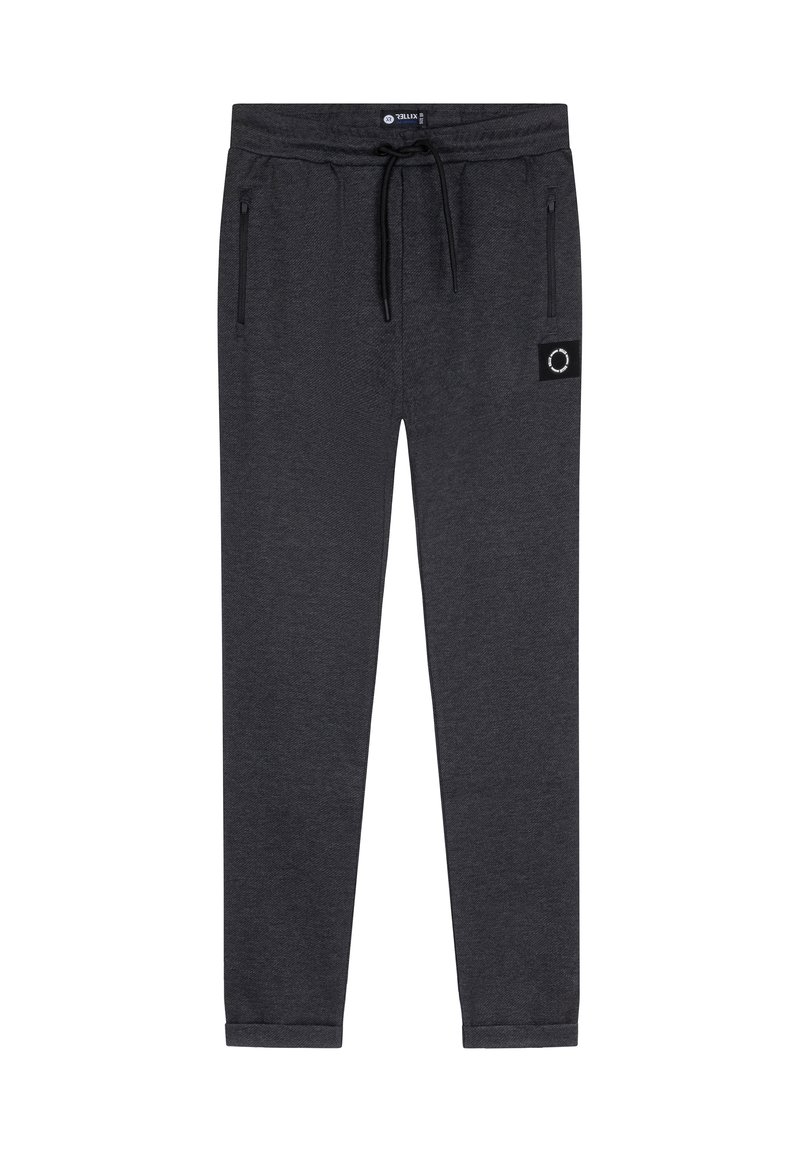 Mørkegrå træningsbukser med elastisk waistband, snøre, sidelommer og et lille patch-label nær venstre lomme. Blød tekstur.