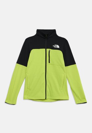 Zeleni in črni pulover z zadrgo, z žepom z zadrgo na prsih in logotipom The North Face na zgornjem desnem delu prsnega koša.