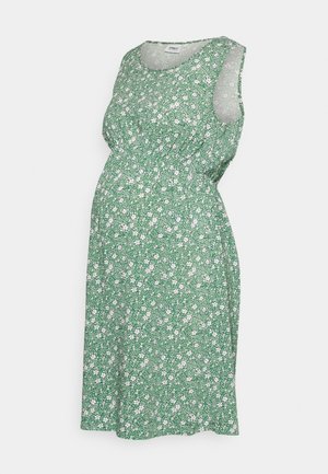 Robe de maternité verte sans manches avec motif floral blanc et taille élastique, longueur genou, encolure ronde.