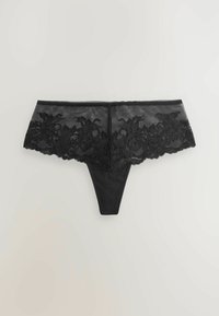 Zwarte string met een brede kanten tailleband met bloemmotieven. Gladde textuur op het lichaam en golvende randen op de kantdetails.