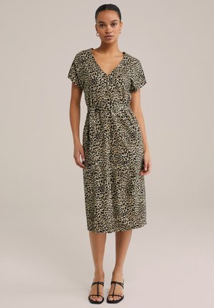 Leopardenmuster-Kleid mit V-Ausschnitt, kurzen Ärmeln, tailliertem Bund und knielangem Saum. Hergestellt aus weichem, strukturiertem Stoff. Verfügt über zwei Seitentaschen.
